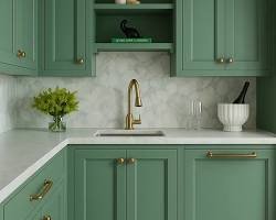 sage green kitchen cabinets with brass hardware interior design, AI generated